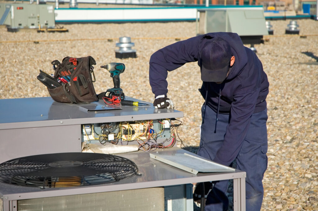 A technician doing preventive maintenance